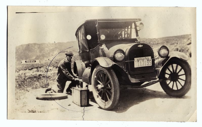 Fixin' a flat. Chevrolet 490 Touring car 1922