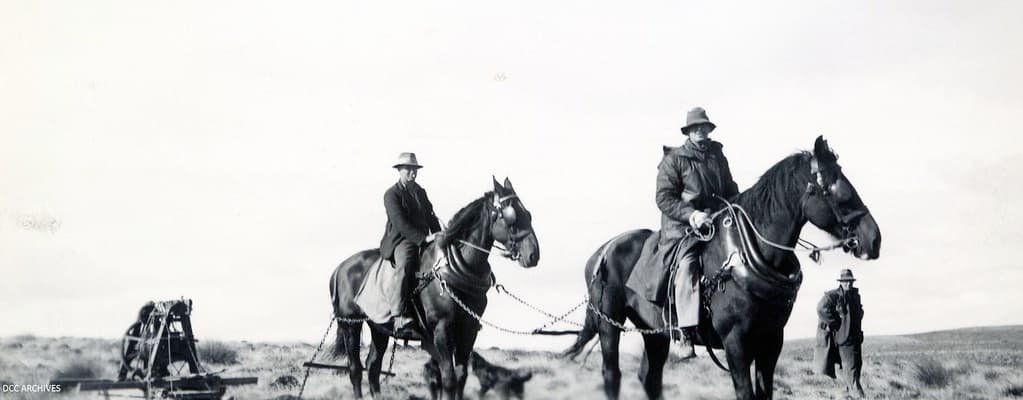 Men on horses touring machinery, Waipori
