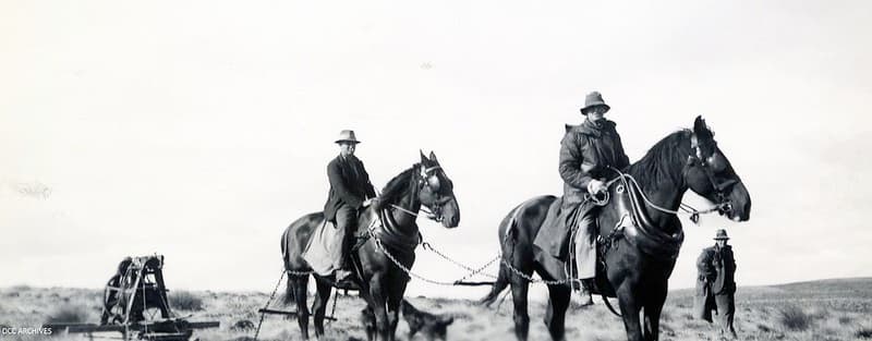 Men on horses touring machinery, Waipori
