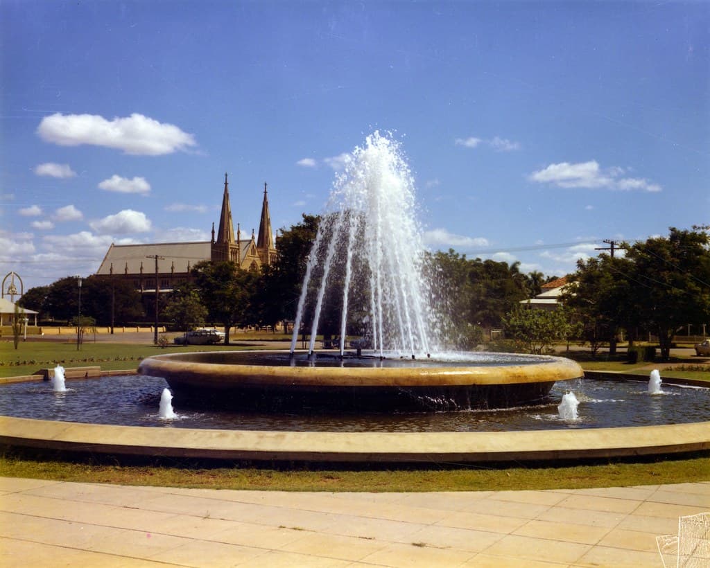 Water fountain and spires at Rockhampton city, November 1974