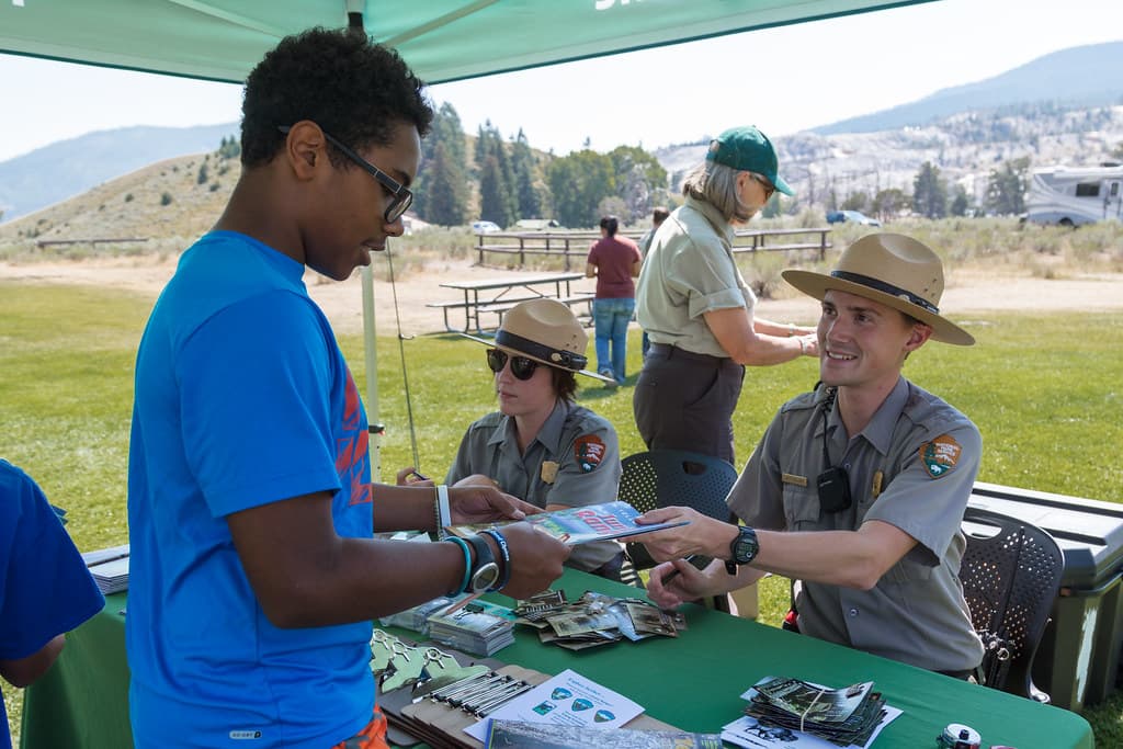 Ranger Jeff hands back a signed Junior Ranger booklet
