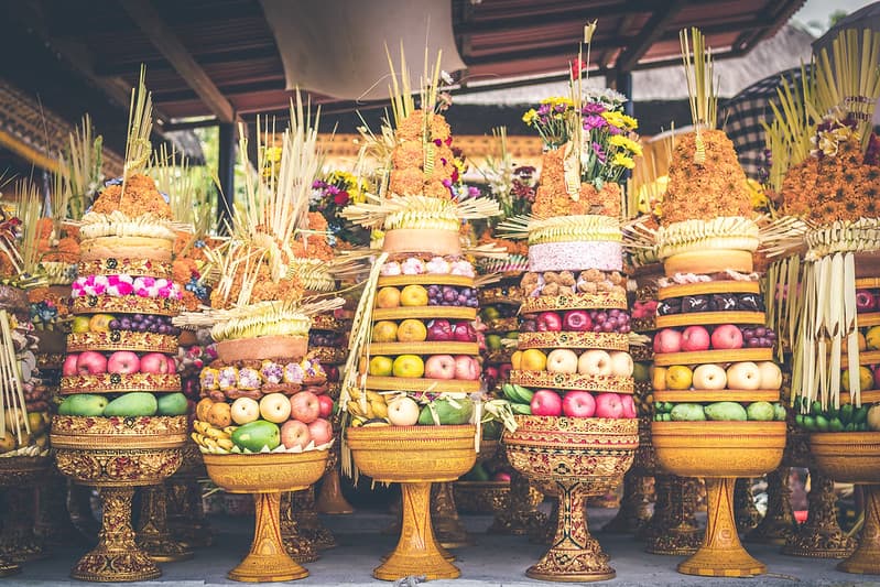 Traditional balinese offerings to Gods with fruits in basket.