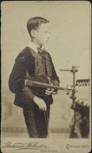 Young boy with violin, c. 1870s