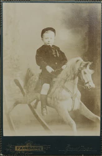 Young boy on rocking horse