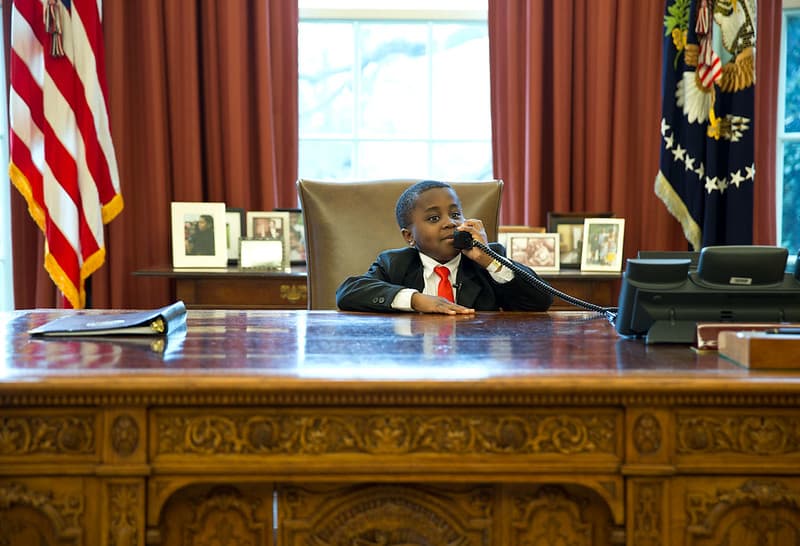 Kid President behind the Resolute desk