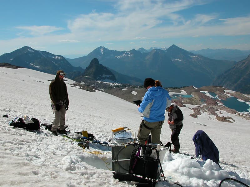Scientists recording data on Sperry Glacier