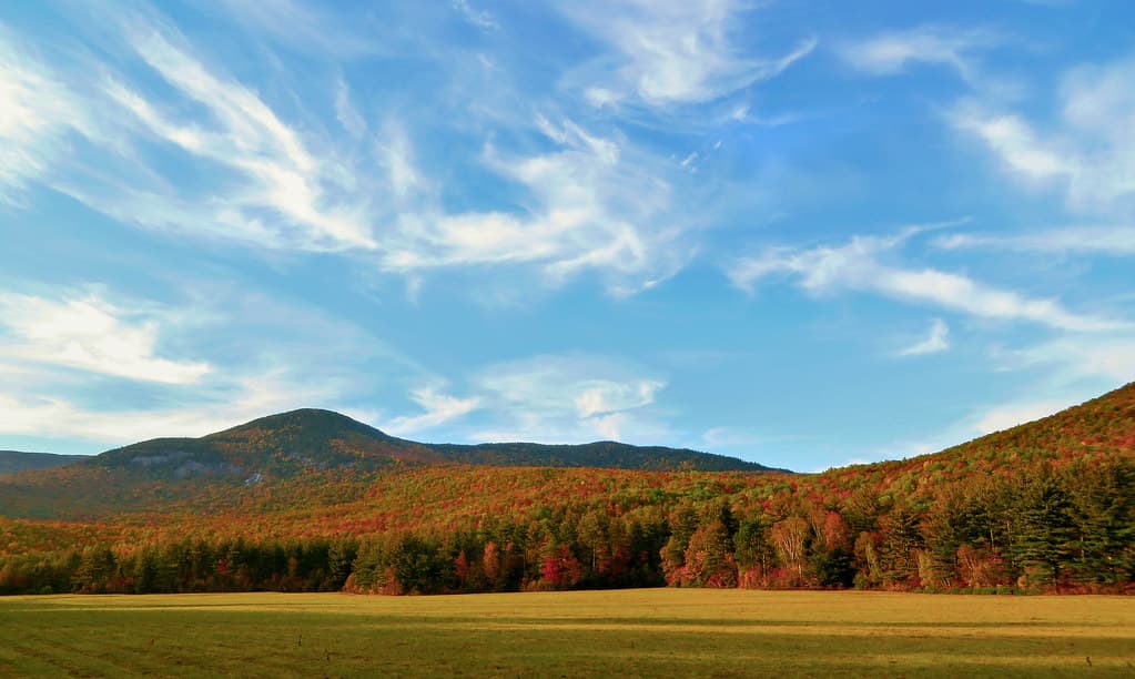 Autumn Foiliage under whispy clouds at Grafton Notch, Maine, USA