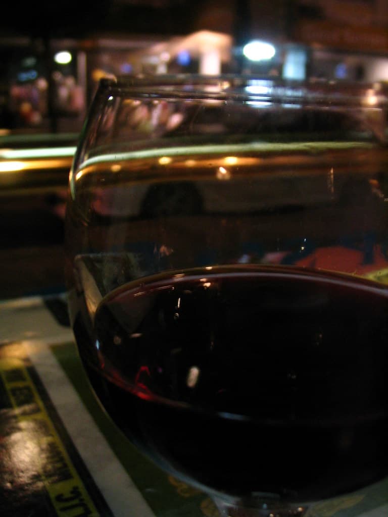 Wine glass in front of window closeup