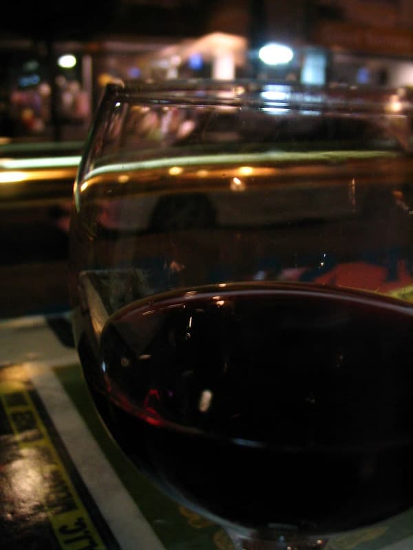 Wine glass in front of window closeup