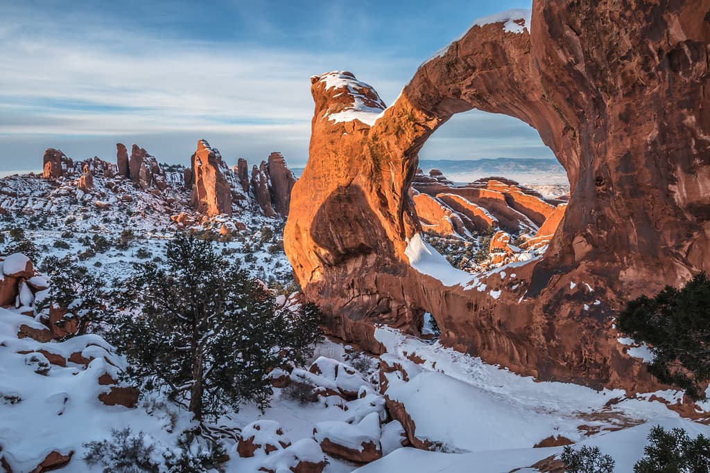 Double O Arch Snowy Sunset