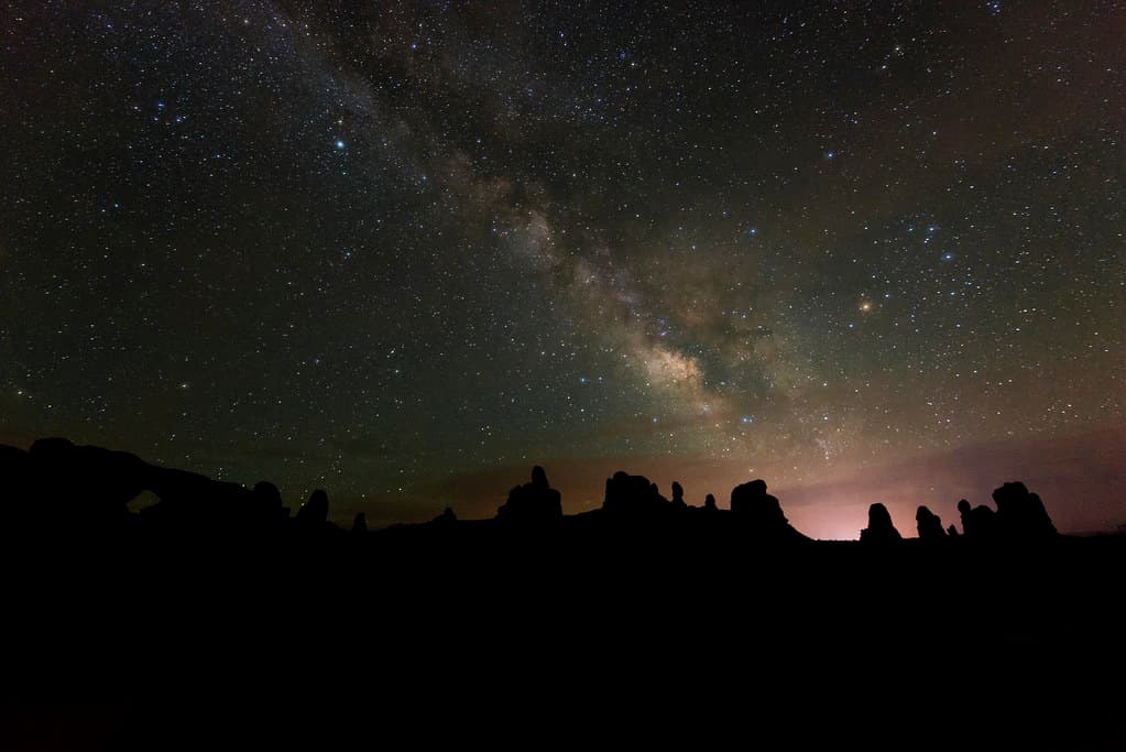 Beyond the glow of the city lights, a universe awaits.