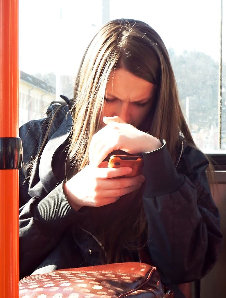 Woman reading Overexposed Smartphone