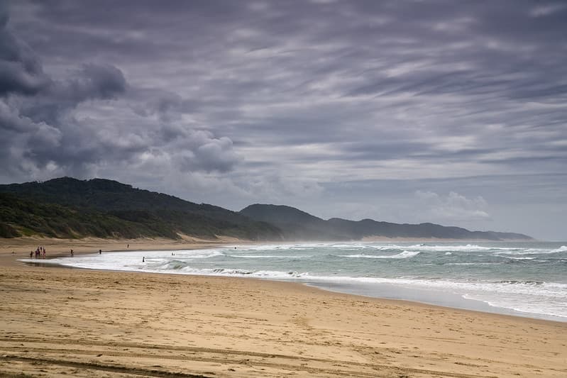 People on Beach with Ocean Waves