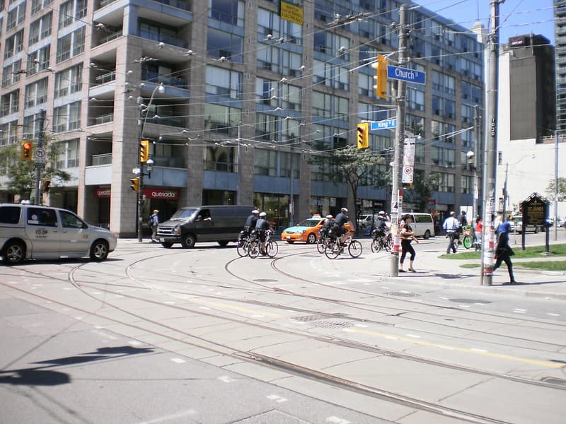 Bicycle cops patrolling Church Street, prior to the G20 -c