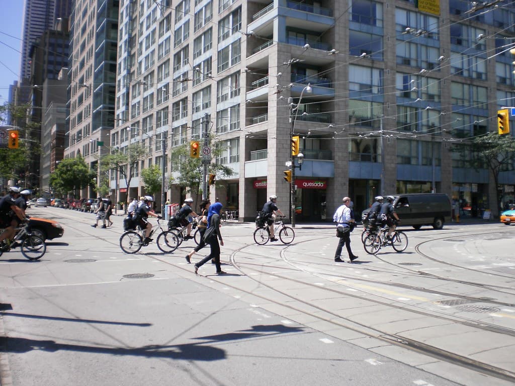 Bicycle cops patrolling Church Street, prior to the G20 -b
