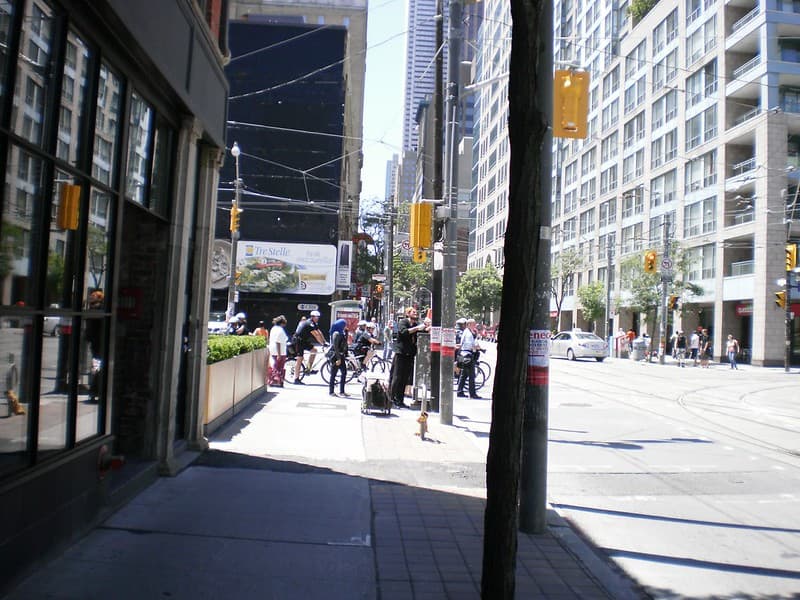 Bicycle cops patrolling Church Street, prior to the G20 -a