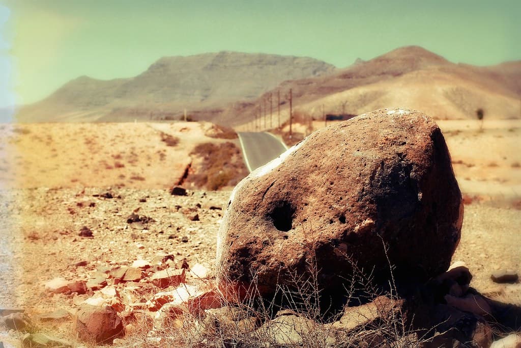 Fuerteventura - red stone in the desert at hot sun