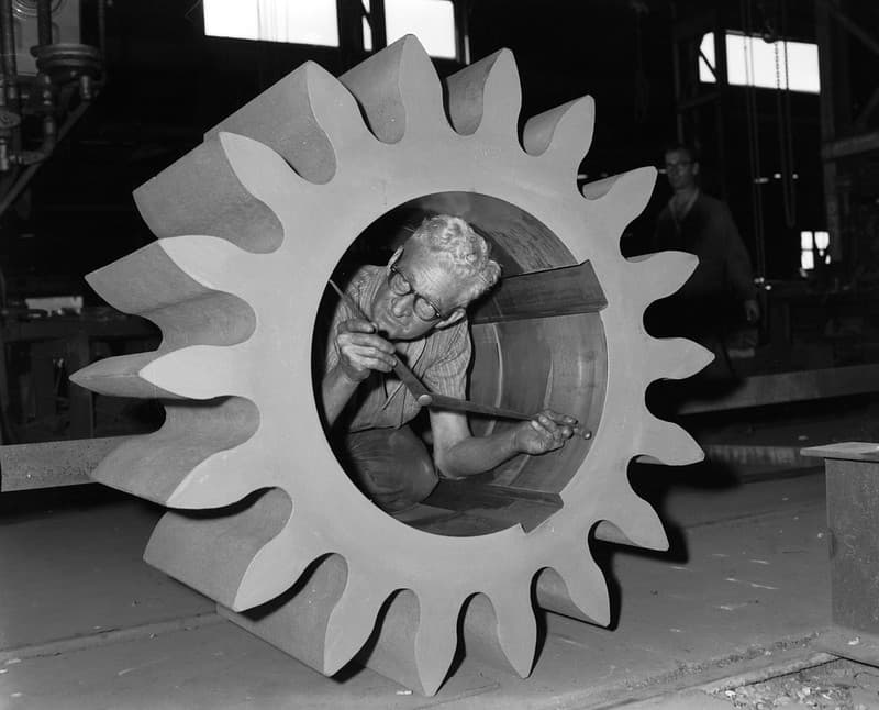 Gear wheel being inspected, Rocklea, 1963