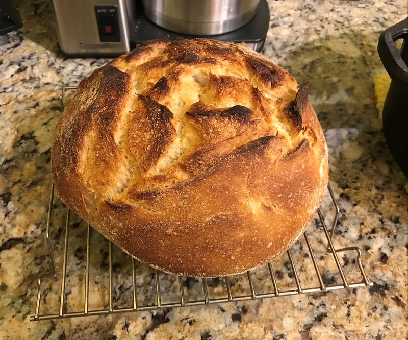 Loaf of sourdough bread cooling