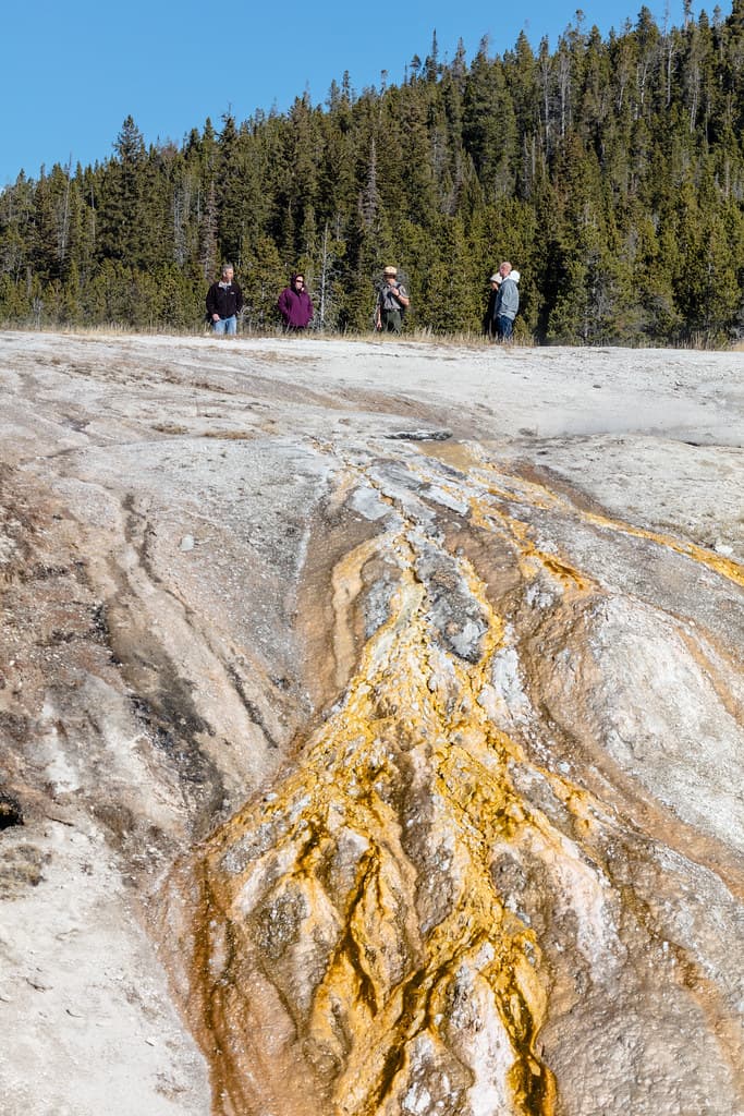 Ranger chats with people on Upper Geyser Basin boardwalks