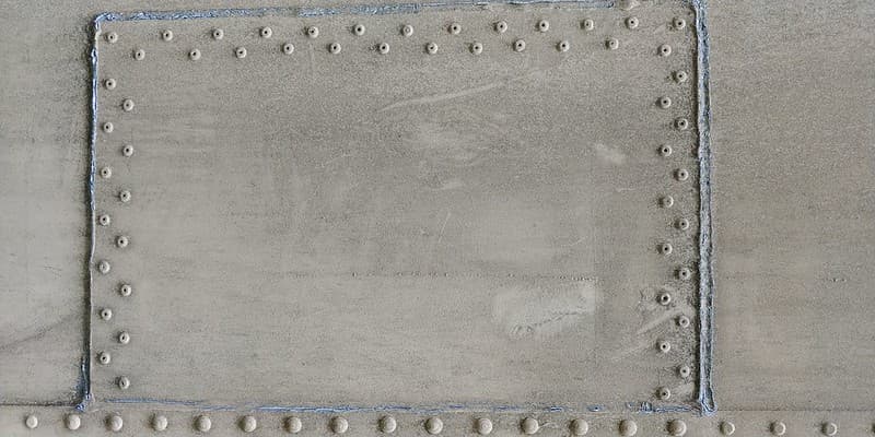 Dirty riveted and welded metal