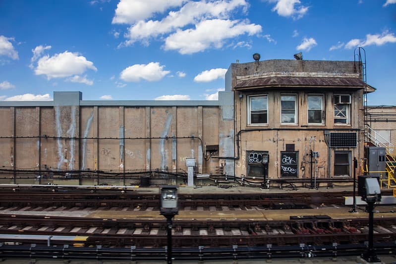 Building by Rail Track with Graffiti