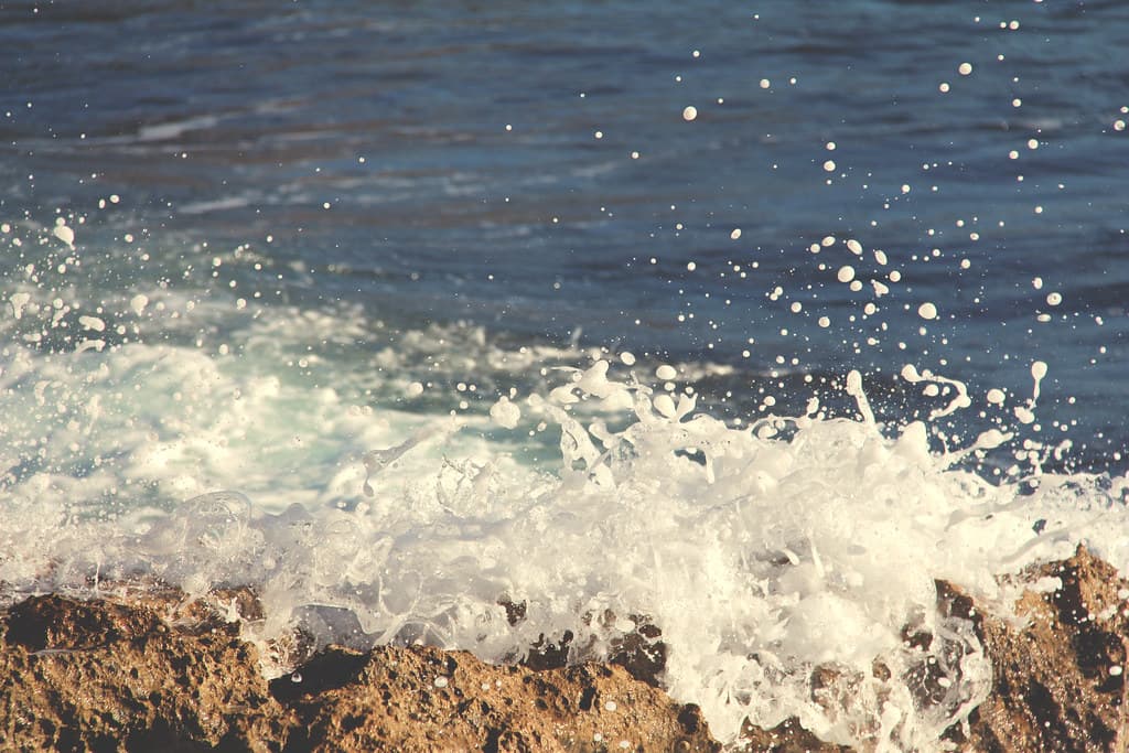 Ocean Water Splashing on Rocks