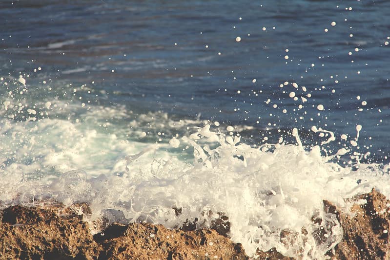 Ocean Water Splashing on Rocks