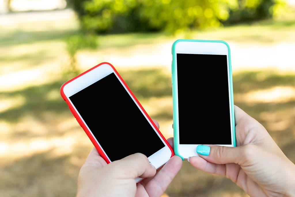 Two smartphones, blank screen