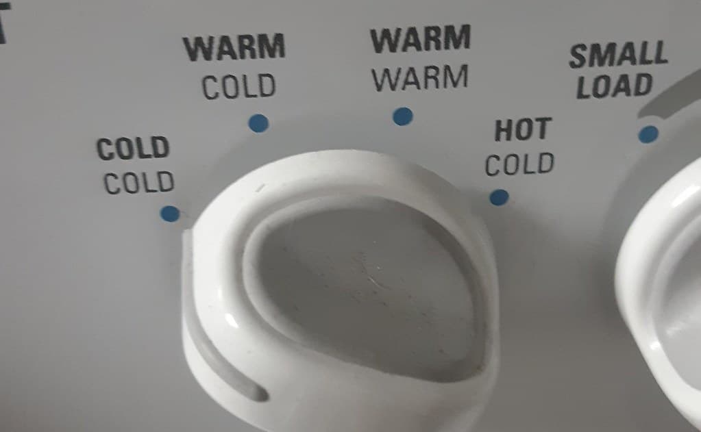Function setting labelling fail on a washing machine control panel