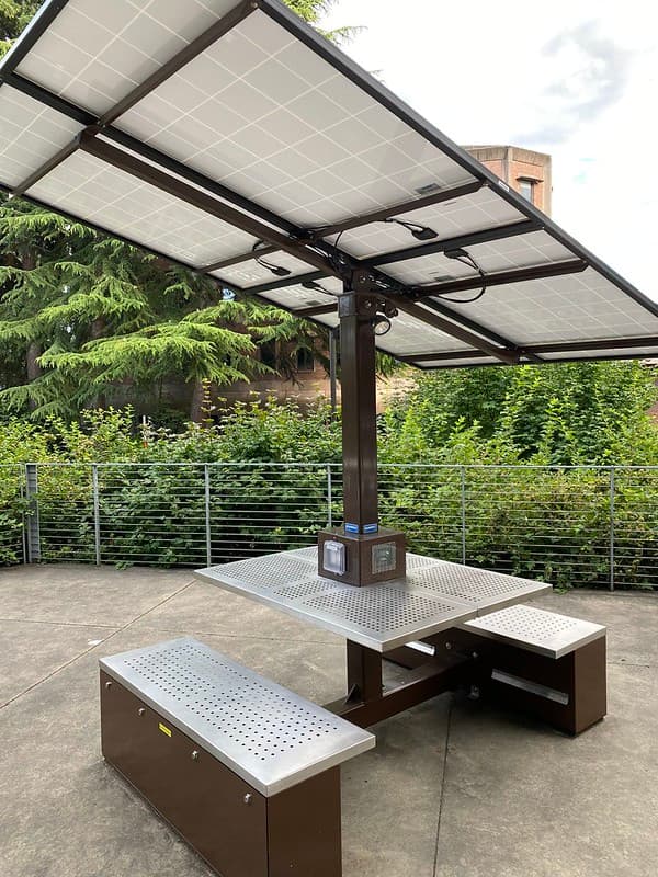 Communal table with solar panel sunshade...