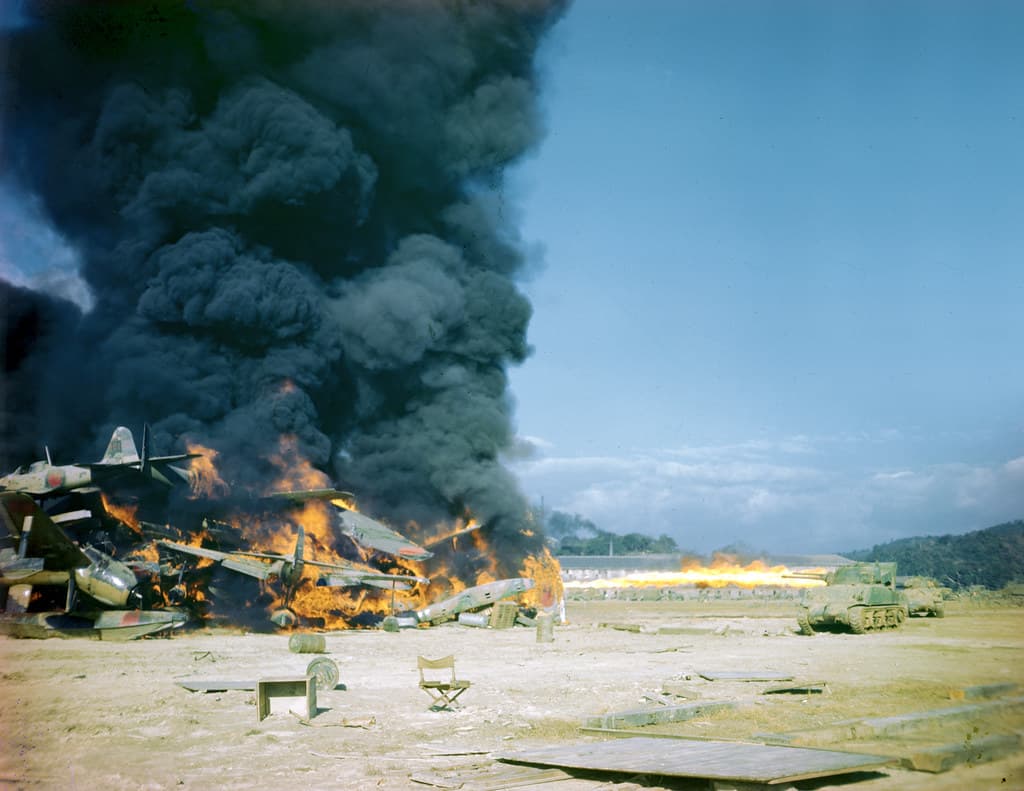Sherman tanks set fire to Japanese aircraft