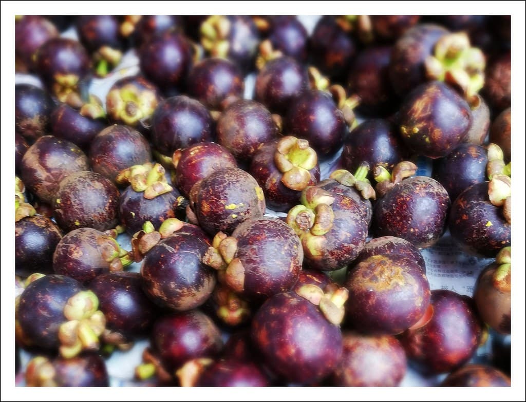 Mangosteen fruit - ugly on the outside, but so, so sweet inside