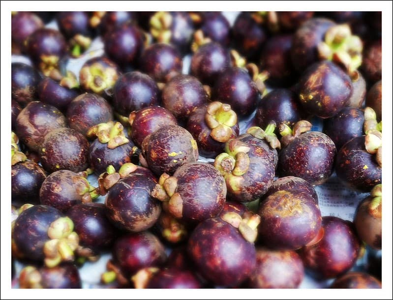 Mangosteen fruit - ugly on the outside, but so, so sweet inside