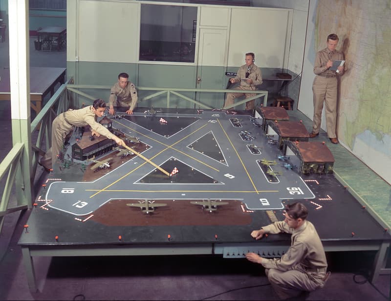 Air traffic control trainees practice on model aircraft