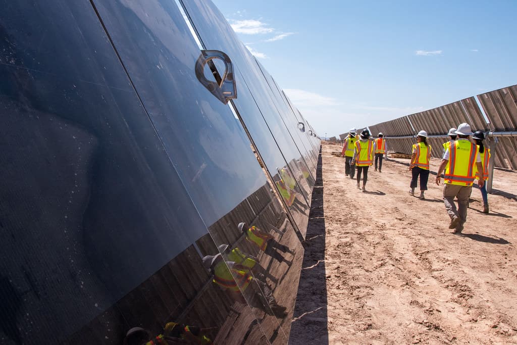 BLM Arizona staff walk through solar panels
