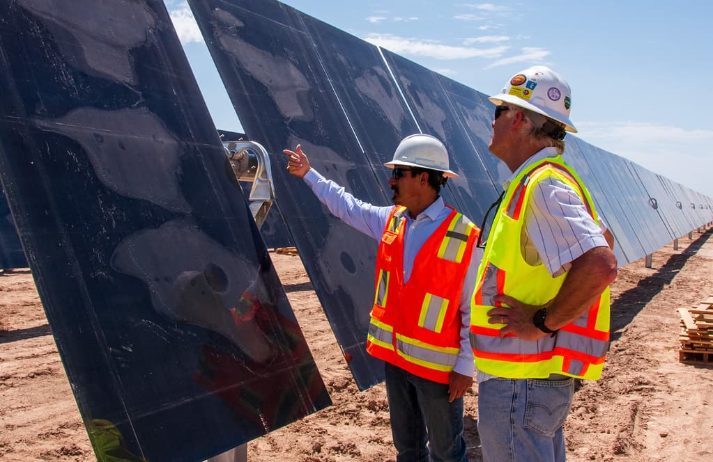 Leeward Renewable Energy staff present solar panels
