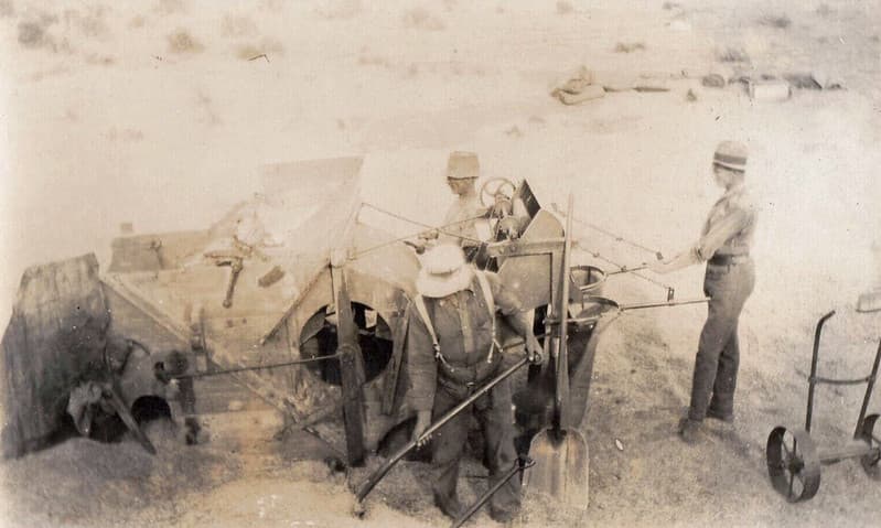 Three men working with machinery somewhere in Australia - early 1900s