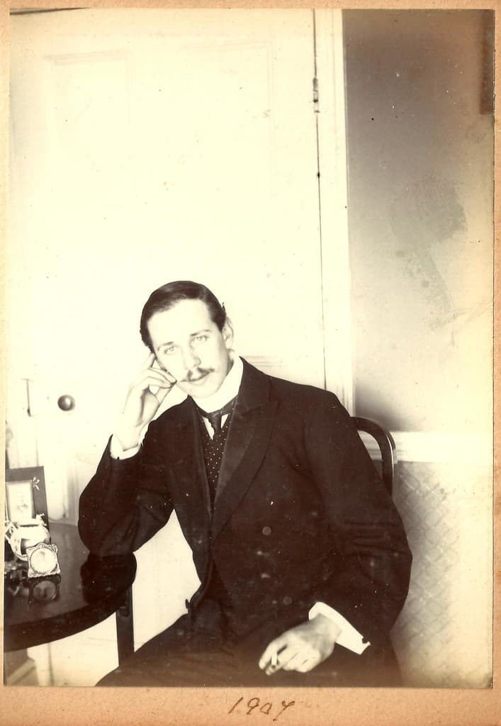 John Hook, seated with cigarette in hand, 1907