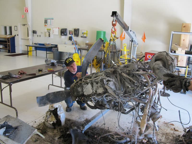 NTSB Intern Jeremy Laurel assisting with engine exam