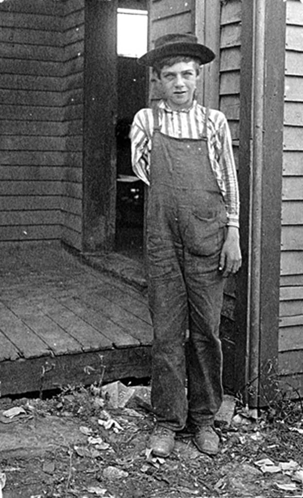 Child Labor: Boy lost arm running saw in box factory, 1909