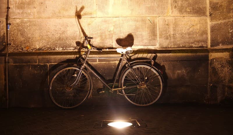 Crummy bicycle against old wall