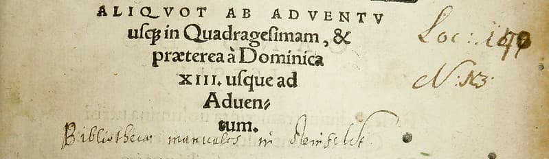 Partially illegible library ownership inscription and shelf-mark