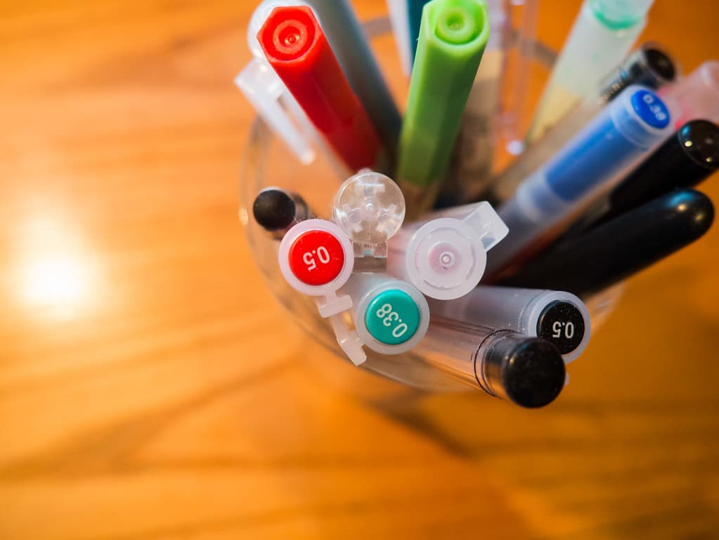 Pen Holder with Pens on Desk