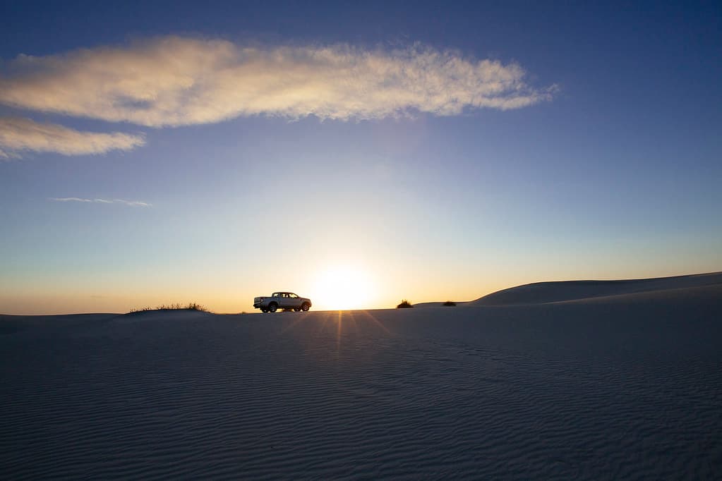 Pickup in a Desert with Sun
