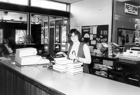 Mount Waverley Branch Library: Circulation desk with staff, 1981