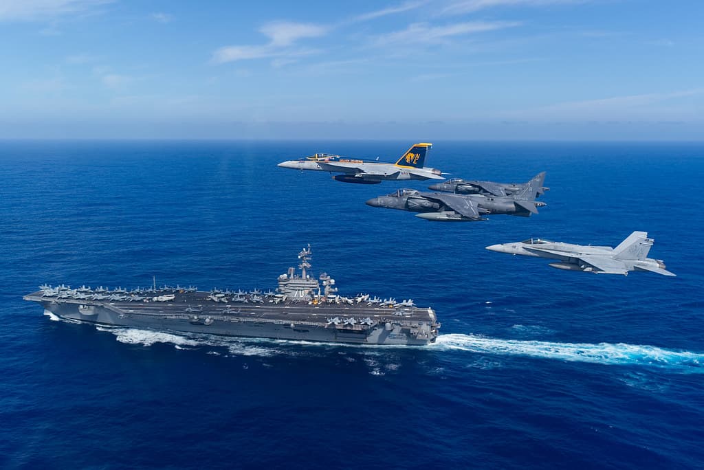 Above the Nimitz-class aircraft carrier USS Carl Vinson (CVN 70)