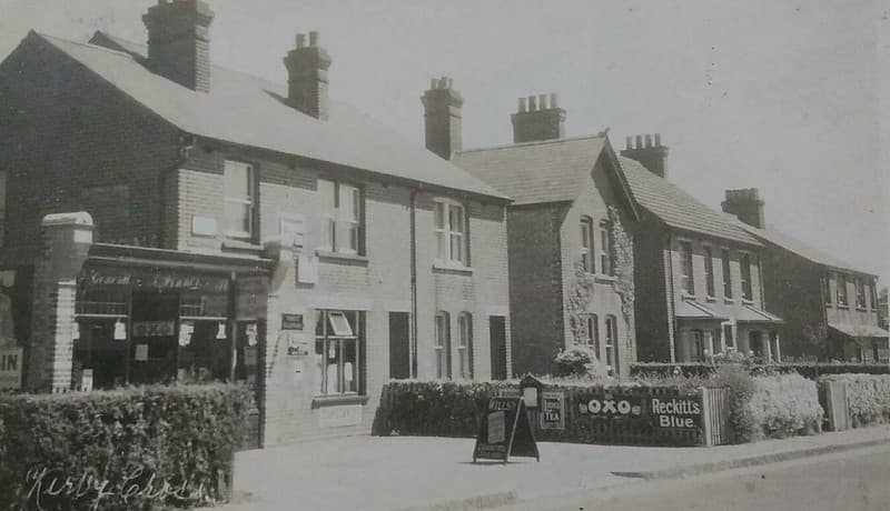 KIRBY CROSS NEAR FRINTON ON SEA SHOP FRONT ADVERTISING 1929 POSTCARD