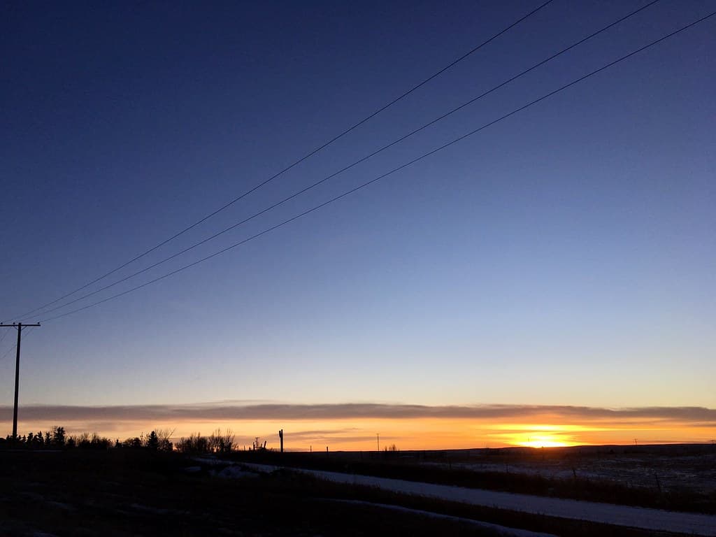 Roads, Wire Converge to the Sunset
