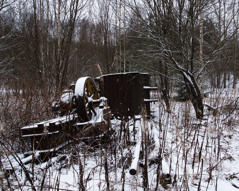 Antique excavation gear in a forest.
